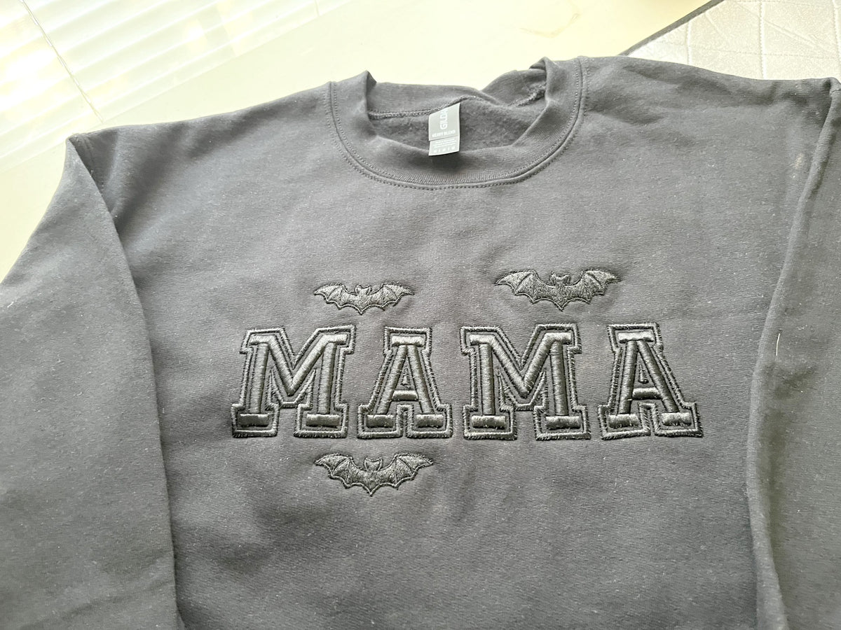 Mama Bats sweatshirt laid flat